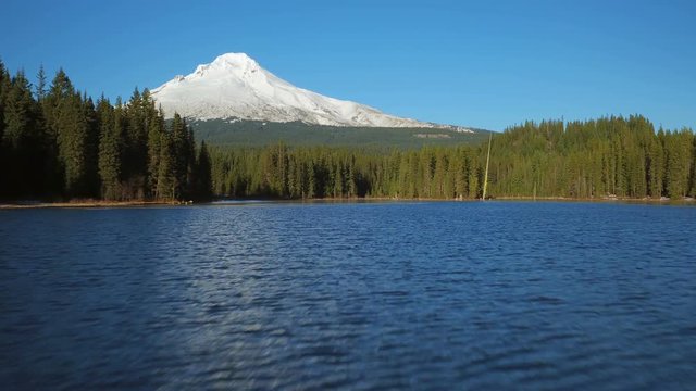 Mt Hood Aerial v20 Flying very low over Trillium Lake towards full mountain views.