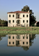 House reflected on the River Brenta, Venice, Italy