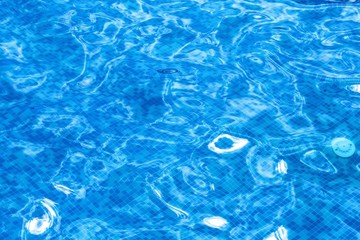 Fototapeta na wymiar Blue ripped water in swimming pool background.