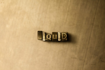 LIQUID - close-up of grungy vintage typeset word on metal backdrop. Royalty free stock illustration.  Can be used for online banner ads and direct mail.