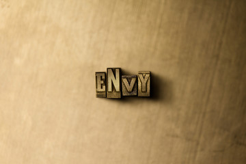 ENVY - close-up of grungy vintage typeset word on metal backdrop. Royalty free stock illustration.  Can be used for online banner ads and direct mail.
