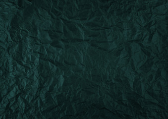 texture of crumpled dark blue paper.