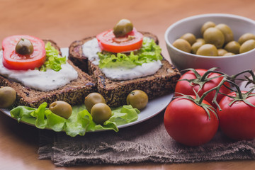 Vegetarian Sandwiches of homemade bread with cheese sauce or cream, lettuce