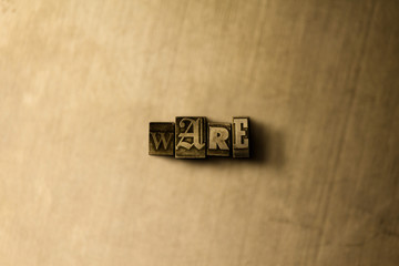 WARE - close-up of grungy vintage typeset word on metal backdrop. Royalty free stock illustration.  Can be used for online banner ads and direct mail.