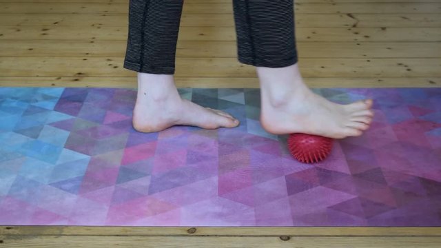 foot massage with a spiky ball