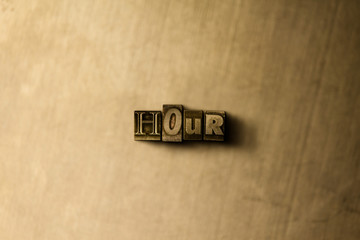 HOUR - close-up of grungy vintage typeset word on metal backdrop. Royalty free stock illustration.  Can be used for online banner ads and direct mail.