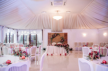 Beautifully decorated wedding hall in white and red colours
