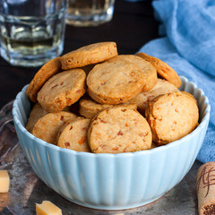 Biscuits with parmesan in a bowl, square