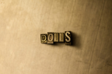 DOLLS - close-up of grungy vintage typeset word on metal backdrop. Royalty free stock illustration.  Can be used for online banner ads and direct mail.