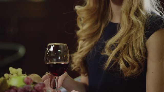 lady drinking red wine in cafe