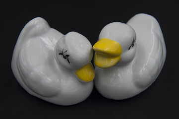 porcelain figurines on a black background