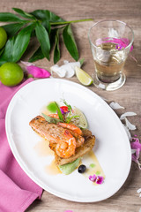 A dish of grilled salmon and shrimp
