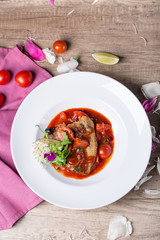 Fish baked in tomato sauce