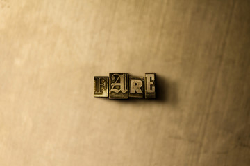 FARE - close-up of grungy vintage typeset word on metal backdrop. Royalty free stock illustration.  Can be used for online banner ads and direct mail.