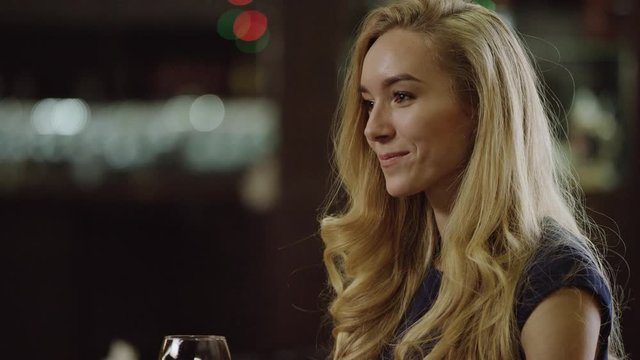 lonely lady drinking red wine in cafe