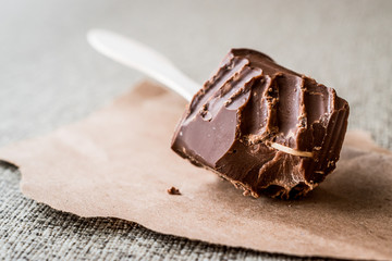 Bitten Chocolate with wooden stick