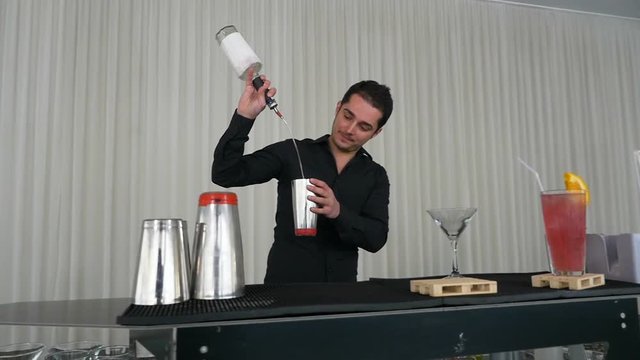 Acrobatic show with shaker made by bartender using flair bartending techniques
