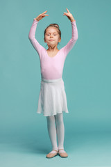 The little balerina dancer on blue background © master1305