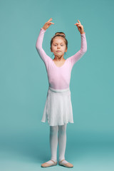 The little balerina dancer on blue background © master1305