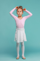 The little balerina dancer on blue background © master1305