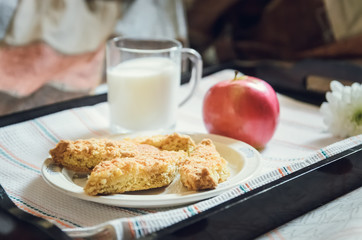 cookies, apple and milk on a tray, healthy breakfast