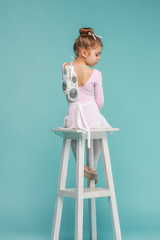 The little balerina dancer on blue background © master1305