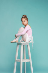 The little balerina dancer on blue background © master1305