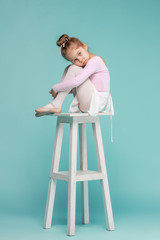 The little balerina dancer on blue background © master1305