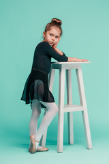The little balerina dancer on blue background © master1305