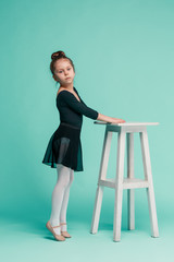 The little balerina dancer on blue background © master1305
