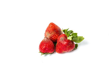 Red ripe strawberries rotten, which have a white mold, small depth of field. not isolated. No longer suitable for consumption.
