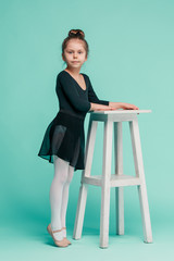 The little balerina dancer on blue background © master1305