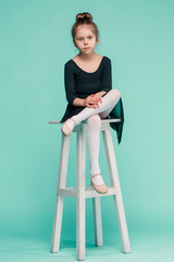 The little balerina dancer on blue background © master1305