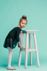 The little balerina dancer on blue background © master1305
