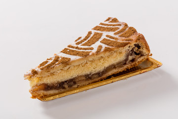 Slice of apple pie on a white background