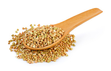 Buckwheat in spoon  isolated on white background