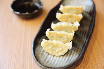 gyoza on wood background