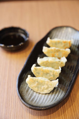 gyoza on wood background