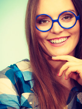 Happy smiling nerdy woman in weird glasses