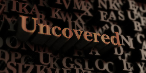 Uncovered - Wooden 3D rendered letters/message.  Can be used for an online banner ad or a print postcard.