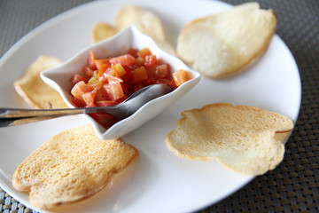 Italian appetizers food , bruschetta slices of toasted baguette garnished with basil and tomato