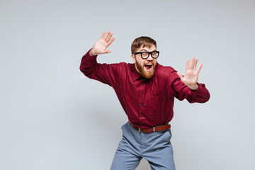Fototapeta premium Funny Male nerd dancing in studio