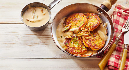 Crisp Potato Pancakes in Pan with Cream Sauce