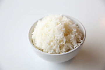 Cooked rice in bowl isolated in white background