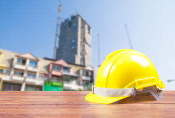 Safety helmet with construction site background
