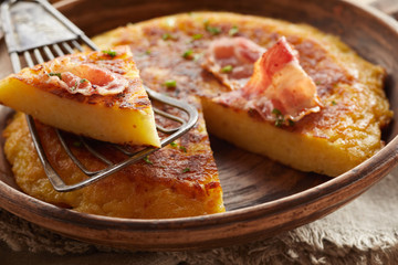 Wedged portion cut from fluffy potato egg dish