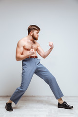 Fototapeta premium Side view of Male nerd as fighter
