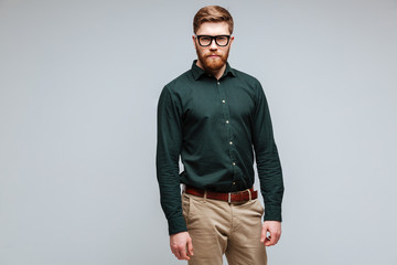 Calm Bearded man in green shirt and eyeglasses
