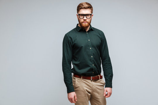 Calm Bearded Man In Green Shirt And Eyeglasses