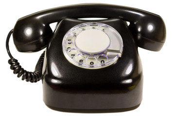Isolated old dial telephone in black close-up on white background